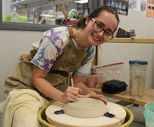 Girl at a potters wheel